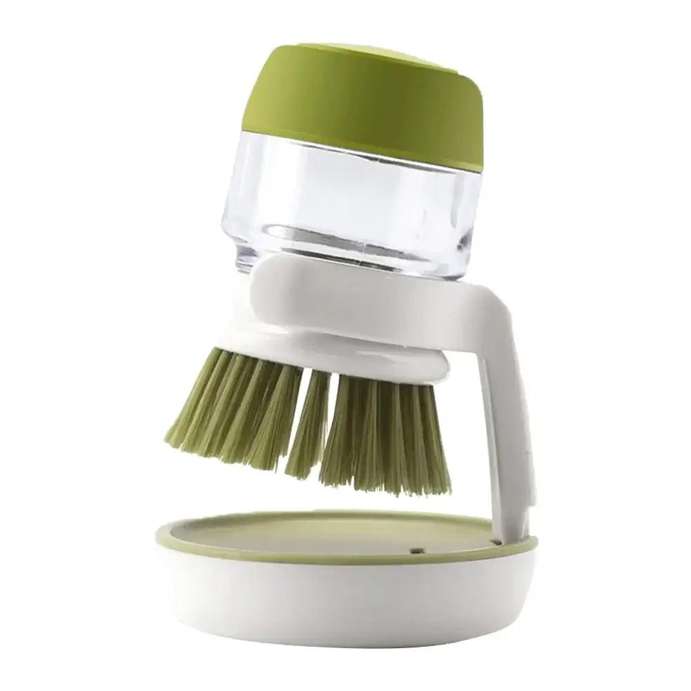 Multifunctional cleaning brush with soap dispenser for kitchen use, featuring a green and white design for easy washing.