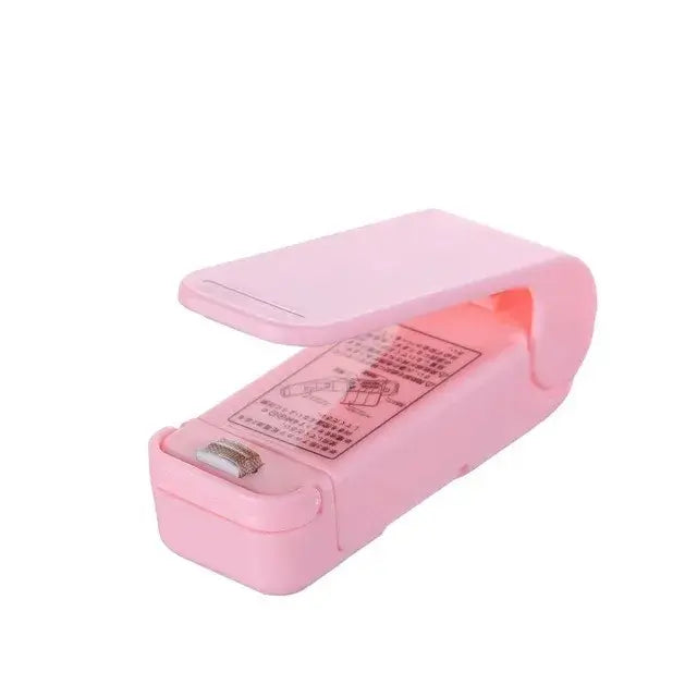Mini heat bag sealing machine in pink, designed for resealing snacks and preserving freshness.