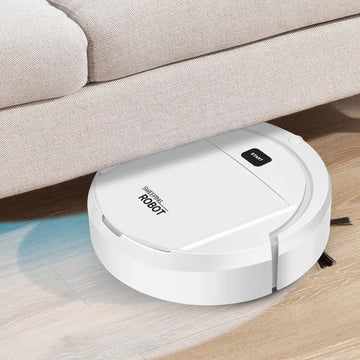 White automatic robot vacuum cleaner under a couch, designed for deep cleaning and low-noise operation.